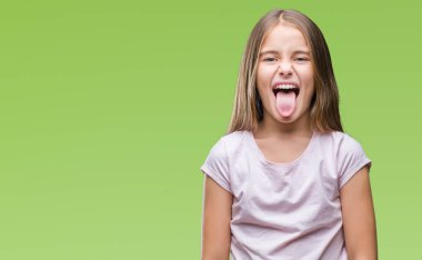 Genç güzel kız dilini izole arka plan üzerinde out komik ifade ile mutlu. Duygu kavramı.