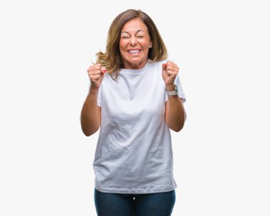 İspanyol kadın kıdemli orta yaş izole arka kolları olan başarı için heyecan üzerinde zafer kutluyor gülümseyen kaldırdı. Kazanan kavramı.