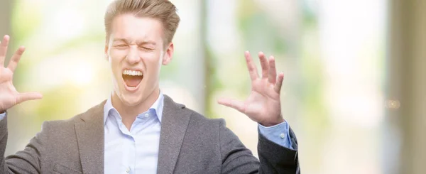 Young Handsome Blond Business Man Celebrating Mad Crazy Success Arms — Stock Photo, Image