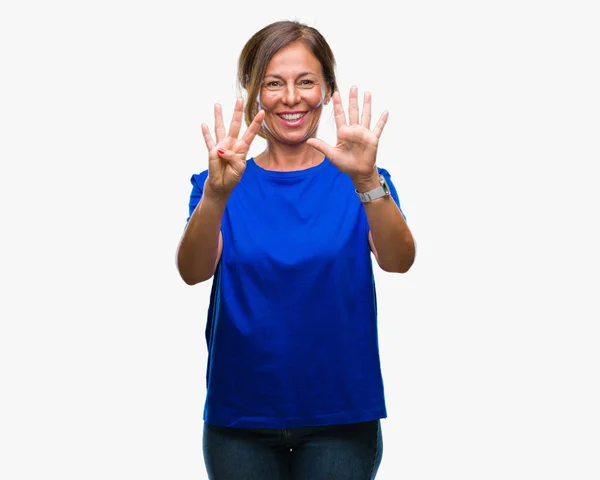 中年年配のヒスパニック系女性分離背景表示と指で上向きにナンバー ナイン自信を持って 幸せな笑みを浮かべて — ストック写真