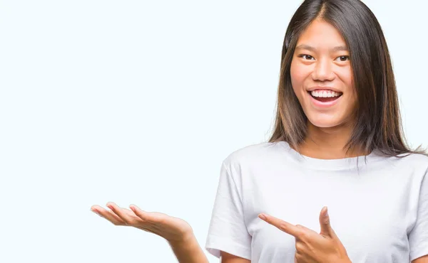 Young Asian Woman Isolated Background Amazed Smiling Camera While Presenting — Stock Photo, Image