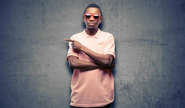 African Black Man Wearing Sunglasses Pointing Away Side Finger — Stock Photo, Image