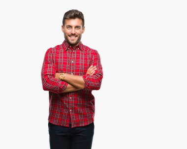 İzole arka plan mutlu yüz çapraz silah kameraya bakarak ile gülümseyen genç yakışıklı adam. Olumlu bir kişi.