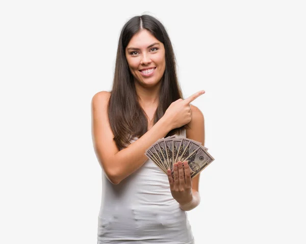 Jeune Femme Hispanique Tenant Des Dollars Très Heureux Pointant Avec — Photo