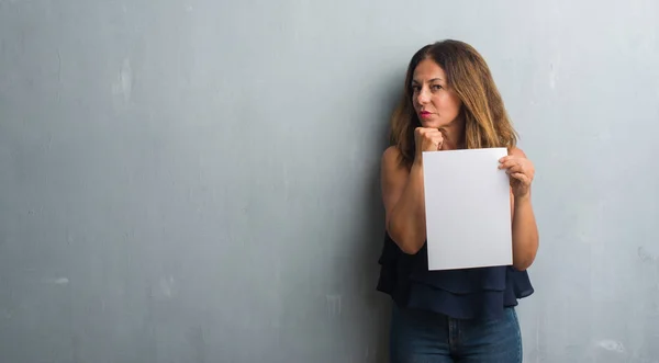 Middle Age Hispanic Woman Holding Bank Paper Sheet Serious Face — Stock Photo, Image