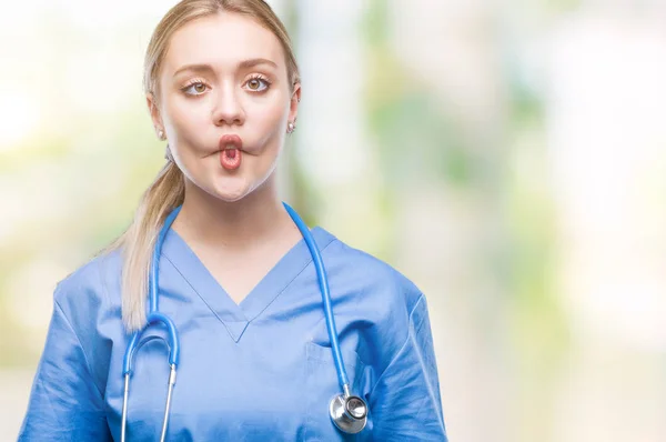 Young Blonde Surgeon Doctor Woman Isolated Background Making Fish Face — Stock Photo, Image