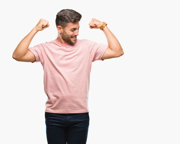 Homem Bonito Jovem Sobre Fundo Isolado Mostrando Músculos Braços Sorrindo — Fotografia de Stock