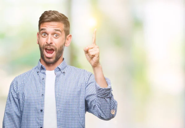 Jonge Knappe Man Dragen Witte Shirt Geïsoleerde Achtergrond Wijzende Vinger — Stockfoto