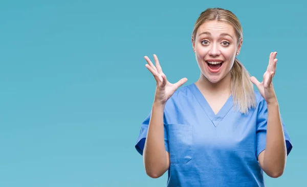 Young Blonde Surgeon Female Doctor Wearing Medical Uniform Blue Background — Stock Photo, Image