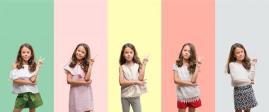 Kolaj esmer İspanyol kız mutlu yüz zafer işareti yaparken kameraya göz kırpıyor ile gülümseyen farklı kıyafetler giyiyor. İki numaralı.