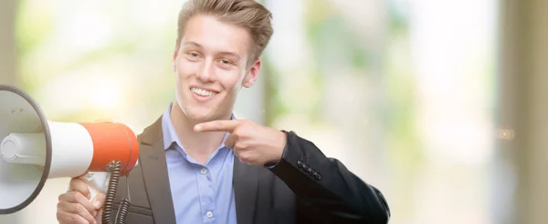 Young Handsome Blond Man Holding Megaphone Very Happy Pointing Hand — Stock Photo, Image