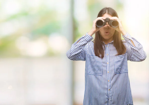 Young Hispanic Woman Holding Binoculars Scared Shock Surprise Face Afraid — Stock Photo, Image