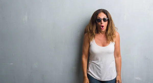 Middle Age Hispanic Woman Grey Wall Wearing Sunglasses Afraid Shocked — Stock Photo, Image