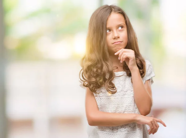 Brunette Hispanic Girl Hand Chin Thinking Question Pensive Expression Smiling — Stock Photo, Image