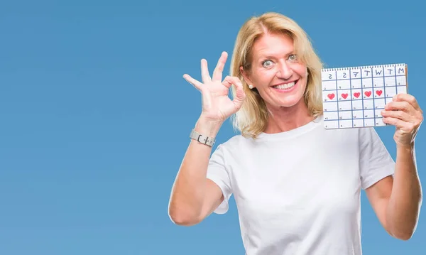 Medelålders Blond Kvinna Håller Menstruation Kalender Ver Isolerade Bakgrund Gör — Stockfoto