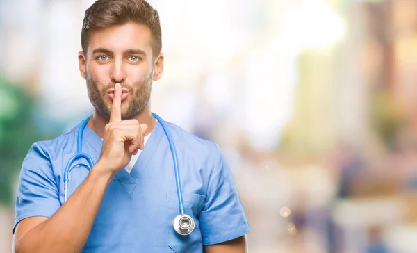 Young Handsome Doctor Surgeon Man Isolated Background Asking Quiet Finger — Stock Photo, Image