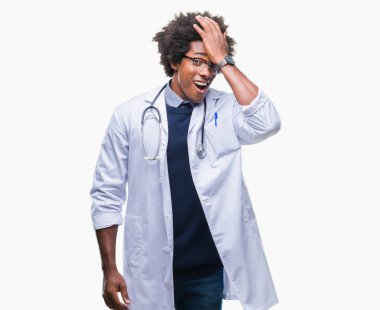Afro american doctor man over isolated background surprised with hand on head for mistake, remember error. Forgot, bad memory concept. clipart