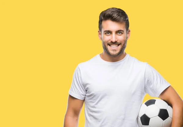 Joven Hombre Guapo Sosteniendo Pelota Fútbol Sobre Fondo Aislado Con — Foto de Stock