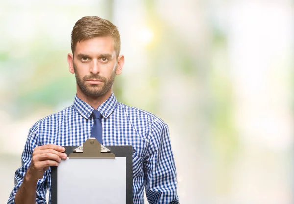 Young Handsome Business Man Holding Clipboard Isolated Background Confident Expression — Stock Photo, Image