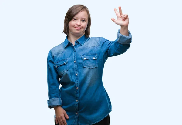 孤立した背景表示と指で上向きにダウン症候群の若い成人女性番号自信を持って 幸せな笑みを浮かべている間 — ストック写真