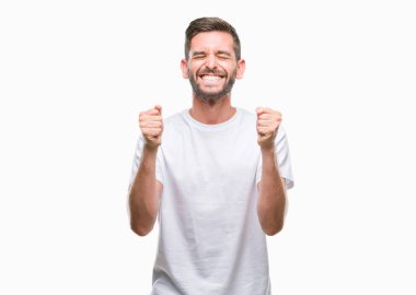 Yakışıklı delikanlı izole arka kolları olan başarı için heyecan üzerinde zafer kutluyor gülümseyen kaldırdı. Kazanan kavramı.
