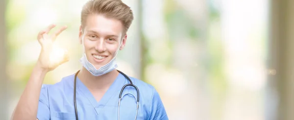 Young Handsome Blond Doctor Doing Sign Fingers Excellent Symbol — Stock Photo, Image