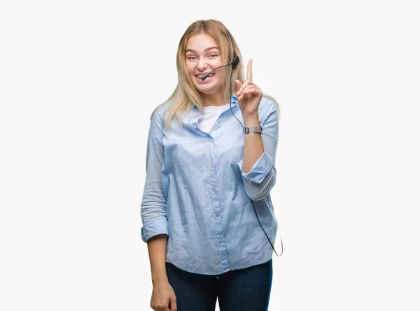 年轻的高加索女商人戴着呼叫中心耳机在孤立的背景指向手指与成功的想法 离开和快乐 — 图库照片