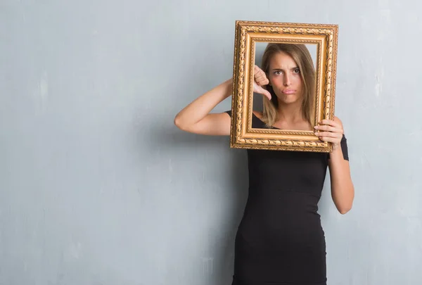 Beautiful Young Woman Grunge Grey Wall Holding Vintage Frame Angry — Stock Photo, Image