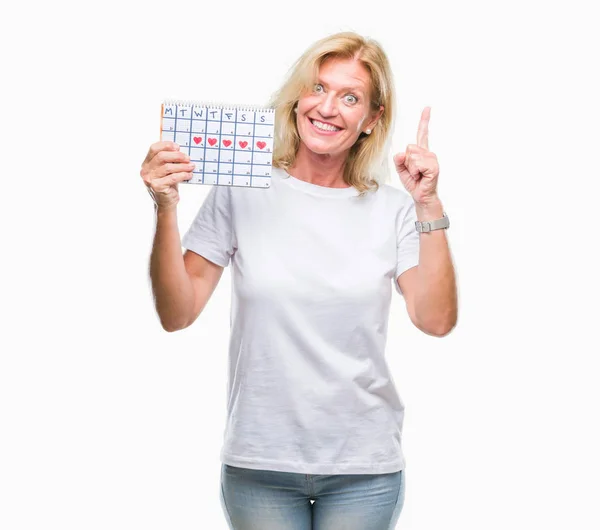 Mulher Loira Meia Idade Segurando Calendário Menstruação Ver Fundo Isolado — Fotografia de Stock