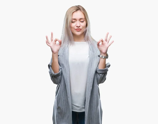 stock image Young blonde business woman wearing jacket over isolated background relax and smiling with eyes closed doing meditation gesture with fingers. Yoga concept.