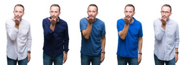 Kolaj bir öpücük el ile güzel ve seksi olmak hava üfleme kamera bakarak izole arka plan üzerinde duran yakışıklı üst düzey ağarmış zarif iş adamı. Aşk ifade.