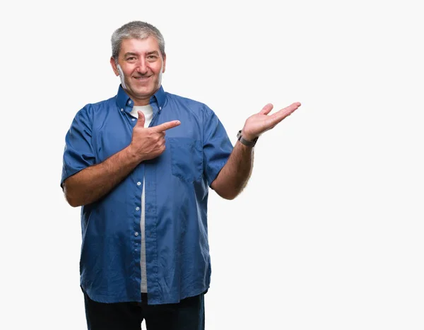 Handsome Senior Man Isolated Background Amazed Smiling Camera While Presenting — Stock Photo, Image