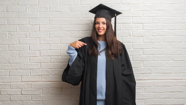 Young Brunette Woman Standing White Brick Wall Wearing Graduate Uniform — Stock Photo, Image