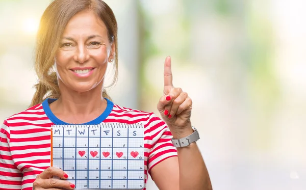 Middle Age Senior Hispanic Woman Holding Menstruation Calendar Isolated Background — Stock Photo, Image