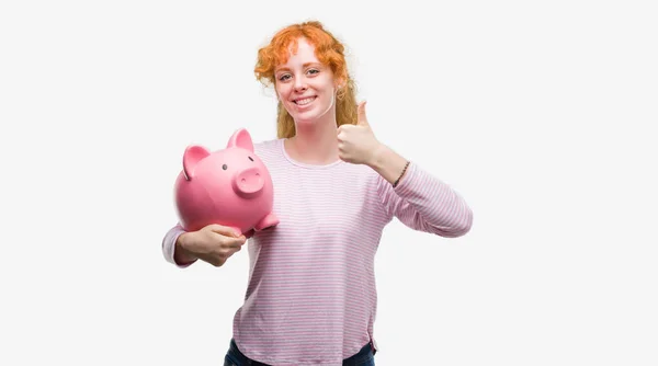 Young Redhead Woman Holding Piggy Bank Happy Big Smile Doing — Stock Photo, Image