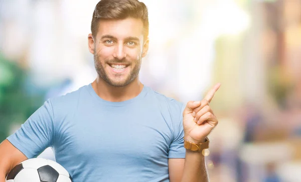 Joven Hombre Guapo Sosteniendo Pelota Fútbol Sobre Fondo Aislado Muy — Foto de Stock