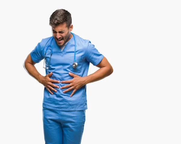 年轻英俊的医生在孤立的背景下与手上的胃因为消化不良 痛苦的疾病感到不适 疼痛概念 — 图库照片