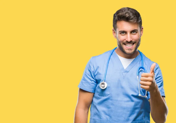 Young Handsome Doctor Surgeon Man Isolated Background Doing Happy Thumbs — Stock Photo, Image