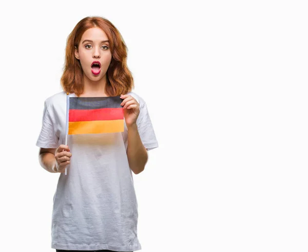 Joven Mujer Hermosa Sosteniendo Bandera Alemania Sobre Fondo Aislado Asustado —  Fotos de Stock