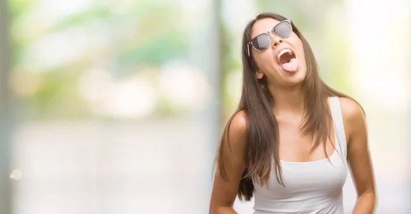 Jovens Belos Hispânicos Vestindo Óculos Sol Colando Língua Feliz Com — Fotografia de Stock