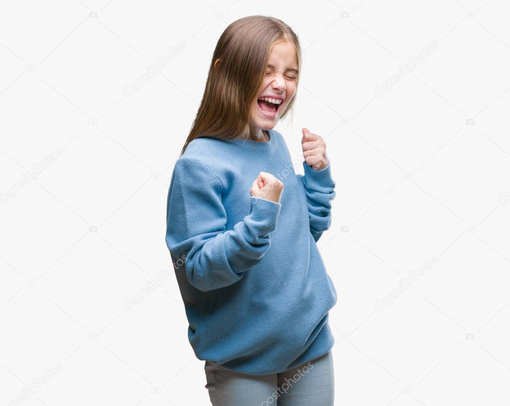 Young beautiful girl wearing winter sweater over isolated background very happy and excited doing winner gesture with arms raised, smiling and screaming for success. Celebration concept.