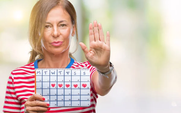 Ältere Hispanische Frau Mittleren Alters Mit Menstruationskalender Über Isoliertem Hintergrund — Stockfoto