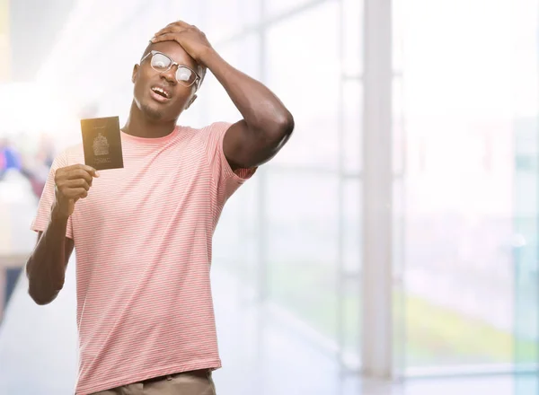 Joven Afroamericano Portador Pasaporte Canadiense Estresado Con Mano Cabeza Conmocionado —  Fotos de Stock