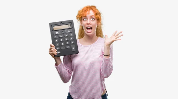 Young Redhead Woman Holding Big Calculator Very Happy Excited Winner — Stock Photo, Image