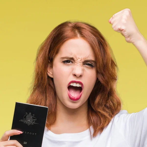 Joven Mujer Hermosa Sosteniendo Pasaporte Australia Sobre Fondo Aislado Molesto — Foto de Stock