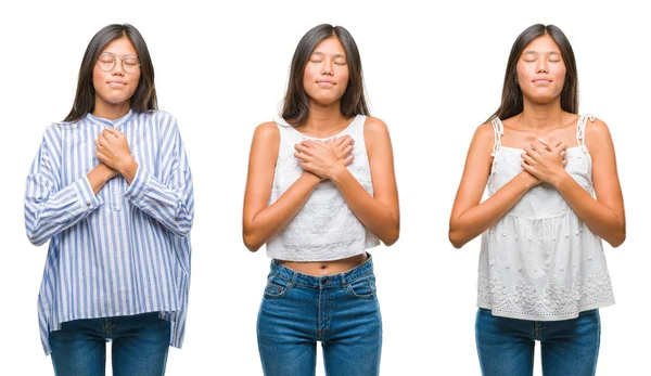 Kolaj Asyalı Genç kadın ayakta gözlük üzerinde beyaz bir arka plan ile kapalı gözler göğüs ellerinde ve yüzünde minnettar jest ile gülümseyen izole. Sağlık kavramı.