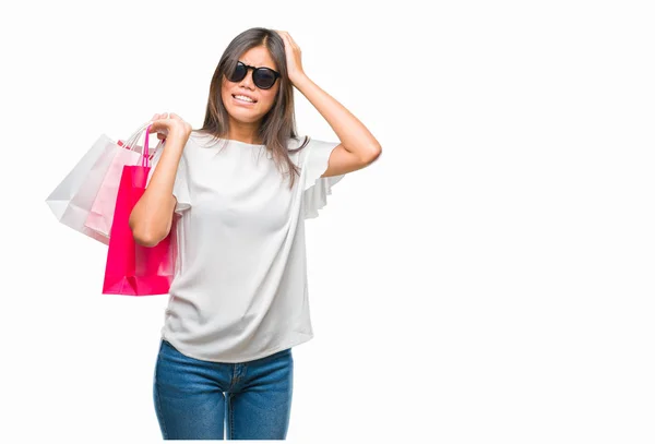 Young Asian Woman Holding Shopping Bags Sales Isolated Background Stressed — Stock Photo, Image