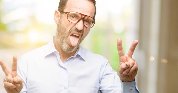 Hombre Mediana Edad Con Gafas Mirando Cámara Mostrando Tanga Haciendo —  Fotos de Stock