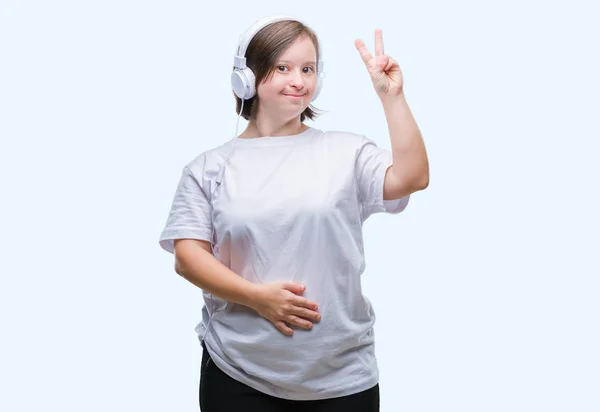 Молода Доросла Жінка Синдромом Дауна Носить Навушники Над Ізольованим Тлом — стокове фото
