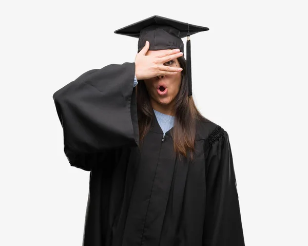 Young Hispanic Woman Wearing Graduated Cap Uniform Peeking Shock Covering — Stock Photo, Image